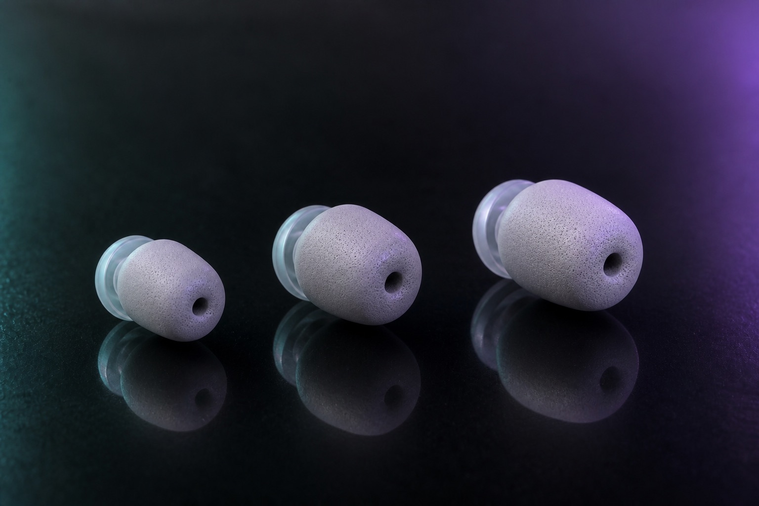 Three sizes of tapered foam-silicone DreamBuds sleeves